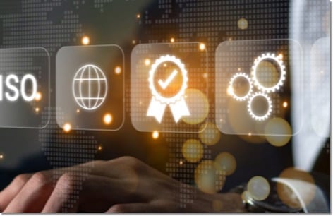 hands on a laptop with floating symbols on tiles in front of the screen