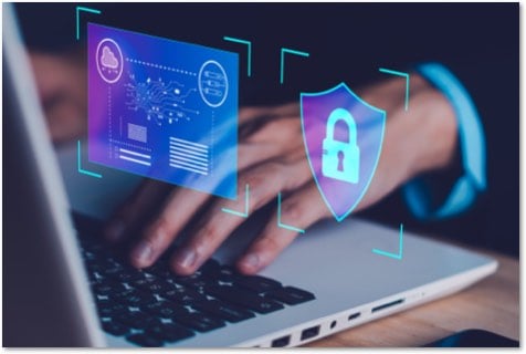 hands on a laptop with floating security symbols on tiles in front of the screen